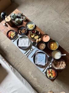 Farm-fresh breakfast spread with fruits, cereals, and traditional delicacies