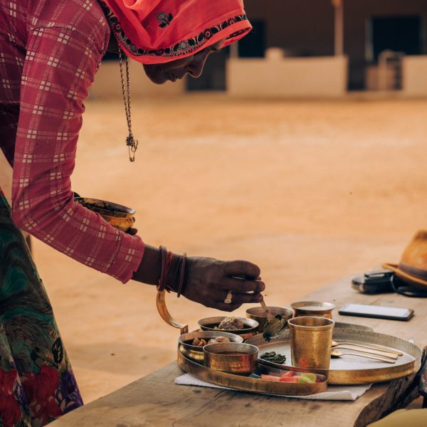 Rajasthani woman serving food